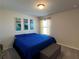 Comfortable bedroom with a large bed, soft carpet, and bright natural light at 4161 Dean Grove Way, Loganville, GA 30052