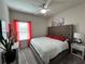 Comfortable bedroom featuring a tufted headboard, soft lighting, and neutral color palette at 4161 Dean Grove Way, Loganville, GA 30052