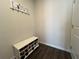Inviting entryway with a shoe rack and a decorative 'LOVE' sign with coat hooks above at 4161 Dean Grove Way, Loganville, GA 30052