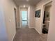 Neutral hallway with carpet and several doors leading to different rooms at 4161 Dean Grove Way, Loganville, GA 30052
