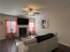 Cozy living room with a fireplace, mounted TV, comfortable seating, and modern décor at 4161 Dean Grove Way, Loganville, GA 30052