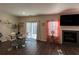 Bright living room featuring modern fireplace, television, and glass table with seating at 4161 Dean Grove Way, Loganville, GA 30052