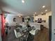 Open concept living space with dining area and kitchen, featuring modern decor and ample natural light at 4161 Dean Grove Way, Loganville, GA 30052