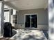 Covered patio features sliding glass doors to indoor space at 4161 Dean Grove Way, Loganville, GA 30052