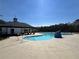 Outdoor community pool with a covered lounge area, perfect for relaxation and recreation at 4161 Dean Grove Way, Loganville, GA 30052