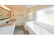 Modern bathroom featuring granite countertop, glass shower and bathtub at 46 Lexie Ct, Rockmart, GA 30153