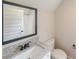 Compact bathroom features a granite-topped vanity and modern fixtures at 46 Lexie Ct, Rockmart, GA 30153