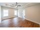 Large bedroom with a tray ceiling, ceiling fan, and Luxury Vinyl Plank flooring at 46 Lexie Ct, Rockmart, GA 30153