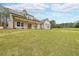 Inviting house featuring a covered entryway, large windows, and a sprawling green lawn at 46 Lexie Ct, Rockmart, GA 30153