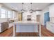 Modern kitchen featuring white cabinets, granite countertops, and stainless steel appliances at 46 Lexie Ct, Rockmart, GA 30153