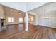 Open-concept living area featuring wood floors, fireplace, and seamless flow to kitchen at 46 Lexie Ct, Rockmart, GA 30153