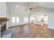 Bright living area with vaulted ceilings, stone fireplace, and access to the kitchen at 46 Lexie Ct, Rockmart, GA 30153