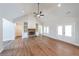 Inviting living space featuring a stone fireplace, built-in shelves, and French doors at 46 Lexie Ct, Rockmart, GA 30153