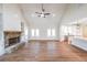 Spacious living room with vaulted ceilings, stone fireplace, and open access to the kitchen at 46 Lexie Ct, Rockmart, GA 30153