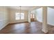 Open-concept living area with hardwood floors, neutral colors, and natural light at 46 Lexie Ct, Rockmart, GA 30153