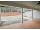 Covered patio offering scenic backyard views with ample space for outdoor seating at 46 Lexie Ct, Rockmart, GA 30153