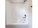 Clean and bright shower with white acrylic surround and black fixtures at 46 Lexie Ct, Rockmart, GA 30153