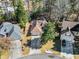Aerial view of a single Gathering home with an attached garage, nestled among mature trees in a tranquil neighborhood at 759 Reeves Lake Sw Dr, Marietta, GA 30064