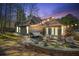 Inviting backyard patio features stone pavers, string lights, and outdoor seating, perfect for entertaining at 759 Reeves Lake Sw Dr, Marietta, GA 30064