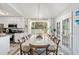 Bright dining area featuring modern lighting and views of the fenced backyard at 759 Reeves Lake Sw Dr, Marietta, GA 30064