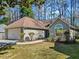 Cozy one-story home with landscaped front yard, two-car garage and a welcoming facade at 759 Reeves Lake Sw Dr, Marietta, GA 30064
