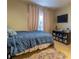 Bedroom featuring wood floors, neutral walls, and a TV at 1062 Glen Chase Dr, Lawrenceville, GA 30044