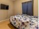 Bedroom featuring wood floors, neutral walls, and a large window at 1062 Glen Chase Dr, Lawrenceville, GA 30044