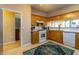 Efficient kitchen layout with a white range, dishwasher, sink, and wooden cabinets at 1062 Glen Chase Dr, Lawrenceville, GA 30044