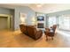 Cozy living room with vaulted ceilings, fireplace, and natural light from the door to the exterior at 1062 Glen Chase Dr, Lawrenceville, GA 30044