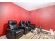 Bonus room featuring three leather recliners on a carpeted platform at 145 Windward Hls, Mcdonough, GA 30253