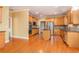 Spacious kitchen featuring wood cabinets, stainless steel appliances, and hardwood floors at 145 Windward Hls, Mcdonough, GA 30253