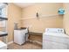 Functional laundry room with washer, dryer, and plenty of storage space at 145 Windward Hls, Mcdonough, GA 30253