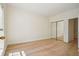 Bedroom features hardwood floors and a mirrored closet at 2921 Lenox Rd # 308, Atlanta, GA 30324