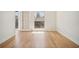 Bedroom featuring light hardwood floors, window, and an exterior door at 2921 Lenox Rd # 308, Atlanta, GA 30324