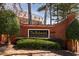 Elegant community sign 'The Richmond Condominiums' framed by brick and lush greenery at 2921 Lenox Rd # 308, Atlanta, GA 30324