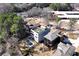 Aerial view of modern home with pool, green roof, and surrounding buildings near a wooded area and highway at 412 Ashwood Sw Ave, Atlanta, GA 30315