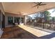 Expansive covered balcony featuring ceiling fans, wood flooring, and scenic views of the outdoors at 412 Ashwood Sw Ave, Atlanta, GA 30315