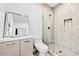 Updated bathroom featuring a tiled shower, modern vanity, and toilet at 412 Ashwood Sw Ave, Atlanta, GA 30315