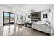 Bright living room featuring a fireplace, ceiling fan, and dual plush sofas at 412 Ashwood Sw Ave, Atlanta, GA 30315