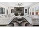 Bright living room featuring a fireplace, ceiling fan, and dual plush sofas at 412 Ashwood Sw Ave, Atlanta, GA 30315