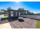 Rooftop deck featuring sleek wood flooring, modern fire pit, and a grassy area, perfect for entertaining at 412 Ashwood Sw Ave, Atlanta, GA 30315