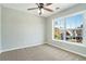 Cozy bedroom with plush carpet and a large window offering natural light and neighborhood views at 885 Clairidge Ln, Lawrenceville, GA 30046