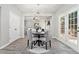 Bright breakfast nook with french doors, modern light fixture, and ample natural light at 885 Clairidge Ln, Lawrenceville, GA 30046