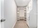 Walk-in closet featuring white shelving and clothing racks for ample storage at 885 Clairidge Ln, Lawrenceville, GA 30046