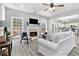 Bright and airy living room with fireplace, hardwood floors, and open floor plan at 885 Clairidge Ln, Lawrenceville, GA 30046