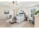 Spacious main bedroom with a ceiling fan, neutral color palette, and large windows at 885 Clairidge Ln, Lawrenceville, GA 30046