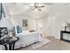 Bright and airy main bedroom features a neutral color palette and comfortable furnishings at 885 Clairidge Ln, Lawrenceville, GA 30046