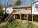 Backyard of home featuring a patio and stairs leading to the 2nd story deck at 1131 Mayfield Dr, Decatur, GA 30033