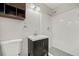 Updated bathroom with a modern vanity, storage, and a white-tiled shower at 1131 Mayfield Dr, Decatur, GA 30033