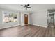 Bright living room with a large window, stained door, fireplace and modern flooring for comfortable living at 1131 Mayfield Dr, Decatur, GA 30033